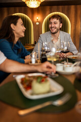 Colleagues Enjoying Lunch with Food and Wine at Restaurant