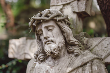 Naklejka premium Stone statue of Jesus bearing the cross 