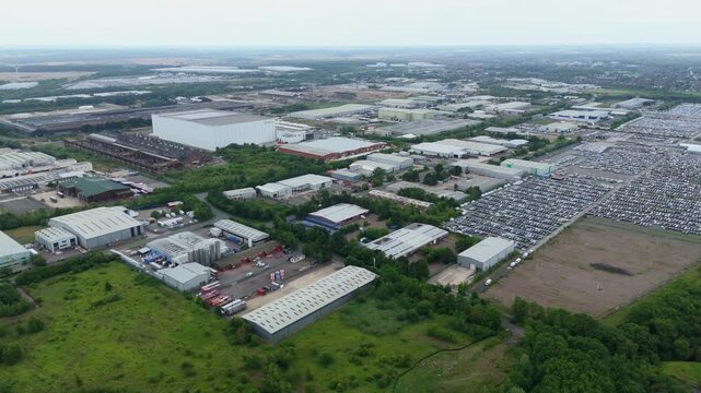 Aerial drone view of Weldon Business park in Corby, industrial warehouses, distribution centres and factories England UK