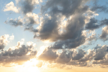 A classic summer evening: soft blue vanilla tones in the sky, with gentle white clouds and powerful dark ones.