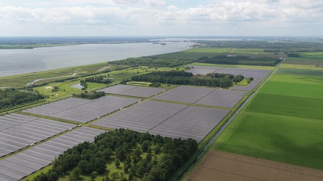 Rural solar electricity hub at industrial scale, bright day, Netherlands