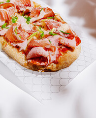 Gourmet flatbread topped with fresh ingredients at a local eatery