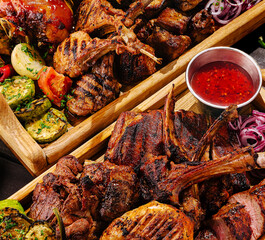 Delicious barbecue platter featuring grilled meats and fresh vegetables