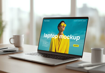 A laptop mockup in a modern office