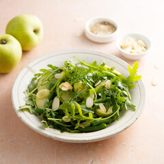 Arugula salad with green apple and almond flakes