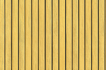 Fototapeta premium Yellow painted wood planks vertical lines texture background