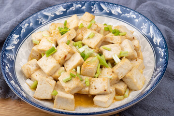The home-cooked dish stir-fried tofu on the plate