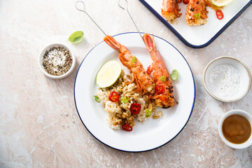 Shrimp skewers with rice and lime