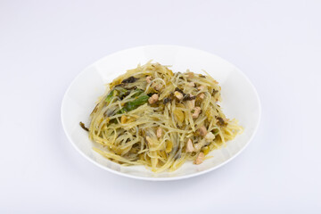 The pickled cabbage, shredded potatoes and stir-fried meat on the plate