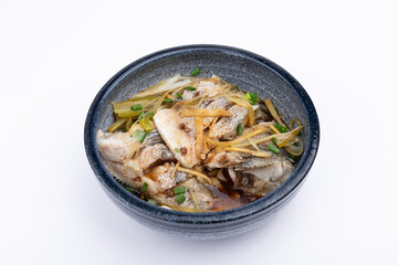 Steamed sea bass in a porcelain bowl