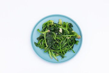 The stir-fried spinach with vegetables on the plate