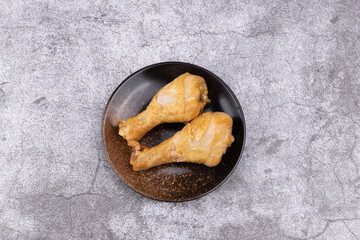 The fragrant marinated chicken legs on the plate