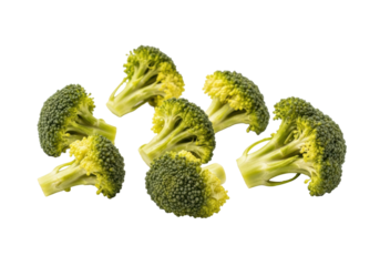 Pale yellow-green, overcooked broccoli pieces with soft, mushy florets and limp stems, scattered on a transparent background, studio shot. Concept of food waste and unappetizing leftovers