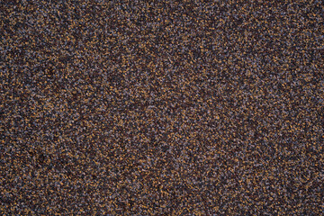 textural plaster of the house wall, colored granite chips, background