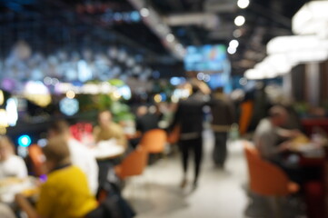 Blurred background. People in the mall.