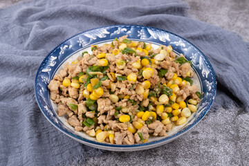 The minced meat stir-fried with corn on the plate