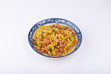 The sausage stir-fried with corn kernels on the plate