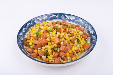 The sausage stir-fried with corn kernels on the plate