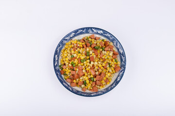 The sausage stir-fried with corn kernels on the plate