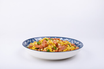 The sausage stir-fried with corn kernels on the plate