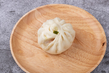 The steamed buns with braised pork filling on the plate