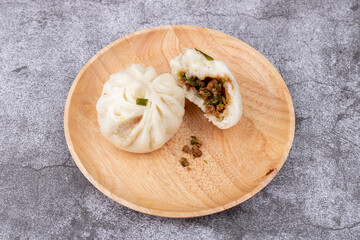 The steamed buns with braised pork filling on the plate