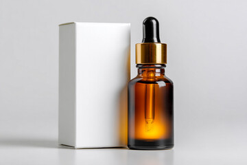 Fototapeta premium Amber glass bottle with dropper and white box on white background simple product packaging design