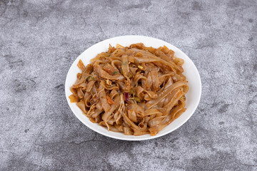 The fried rice noodles on the plate