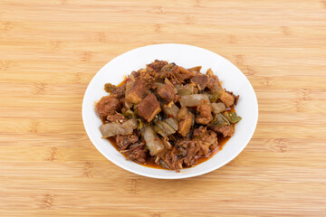 The pickled cabbage and konjac braised duck on the plate