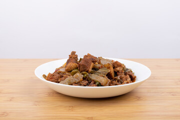 The pickled cabbage and konjac braised duck on the plate