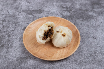 The steamed buns with braised pork filling on the plate