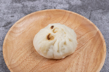 The steamed buns with braised pork filling on the plate