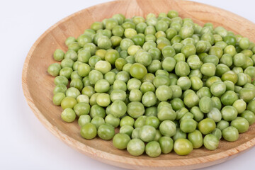 Raw peas on the plate