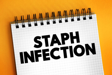 Staph Infection - are caused by staphylococcus bacteria, medical text concept on notepad