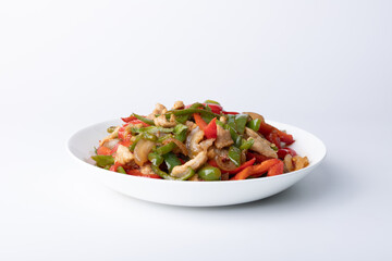 The stir-fried meat with green and red peppers on the plate