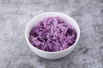 Purple sweet potato rice in a small bowl