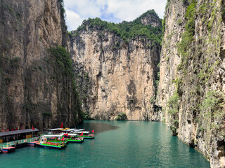 Excursion boats at Baquan (Eight Springs) Gorge in Changzhi, Shanxi, China, within Taihang Grand Canyon, known for dramatic scenery, towering cliffs.