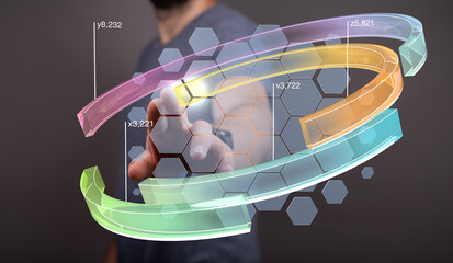Stock photo of a person interacting with a holographic interface showing data streams and growth charts.