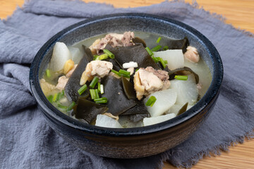 Chicken stewed with kelp and radish in a porcelain bowl
