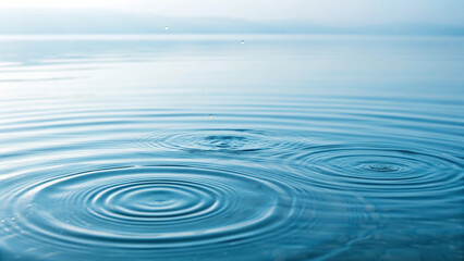 Gentle Ripples on Calm Blue Water with Falling Drops image photo