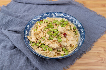 The stir-fried edamame with bean curd sheets on the plate