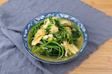 Spinach and scrambled eggs on the plate