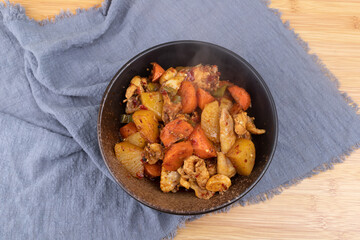 Chicken braised with carrots and potatoes