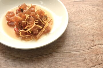slick pickled rasidh with ginger and chili Chinese salad on plate