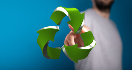 Eco-friendly concept.  Hand pointing at a 3D recycling symbol. Sustainable future.