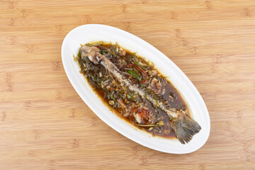 Steamed sea bass bones on the plate