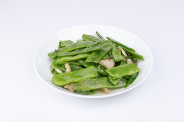 The stir-fried pork with green beans on the plate