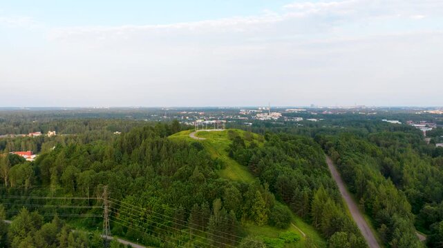 Aerial view rotating toward the Malminkartanonhuippu hill, summer in Helsinki