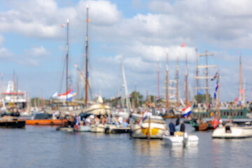 Abstract blurred background, Out of focus sail boat parade in the north sea canal (Noordzeekanaal) SAIL is a maritime event held once every five years in Amsterdam, Tall ships from all over the world.