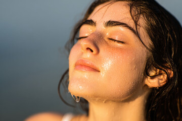 closeup portrait of person face with glowing dewy skin after intense workout radiates vitality